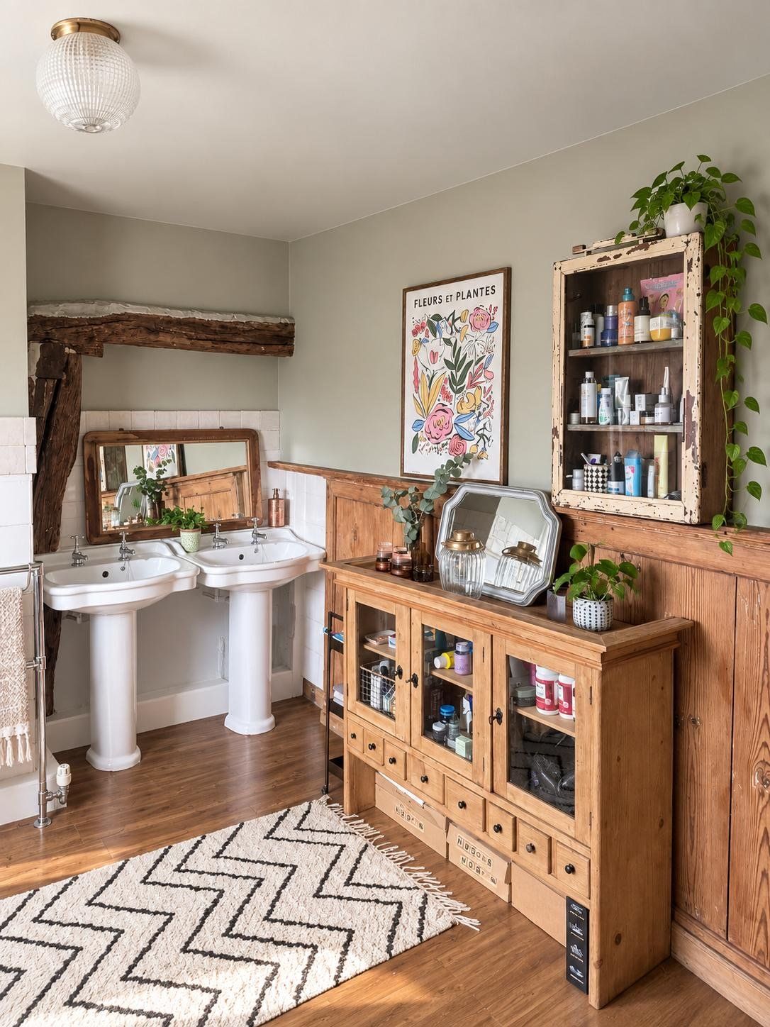 Two basins and a pine cabinet in the family bathroom