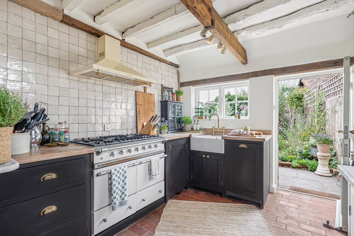 The butler sink under the window, with the back door open to the garden